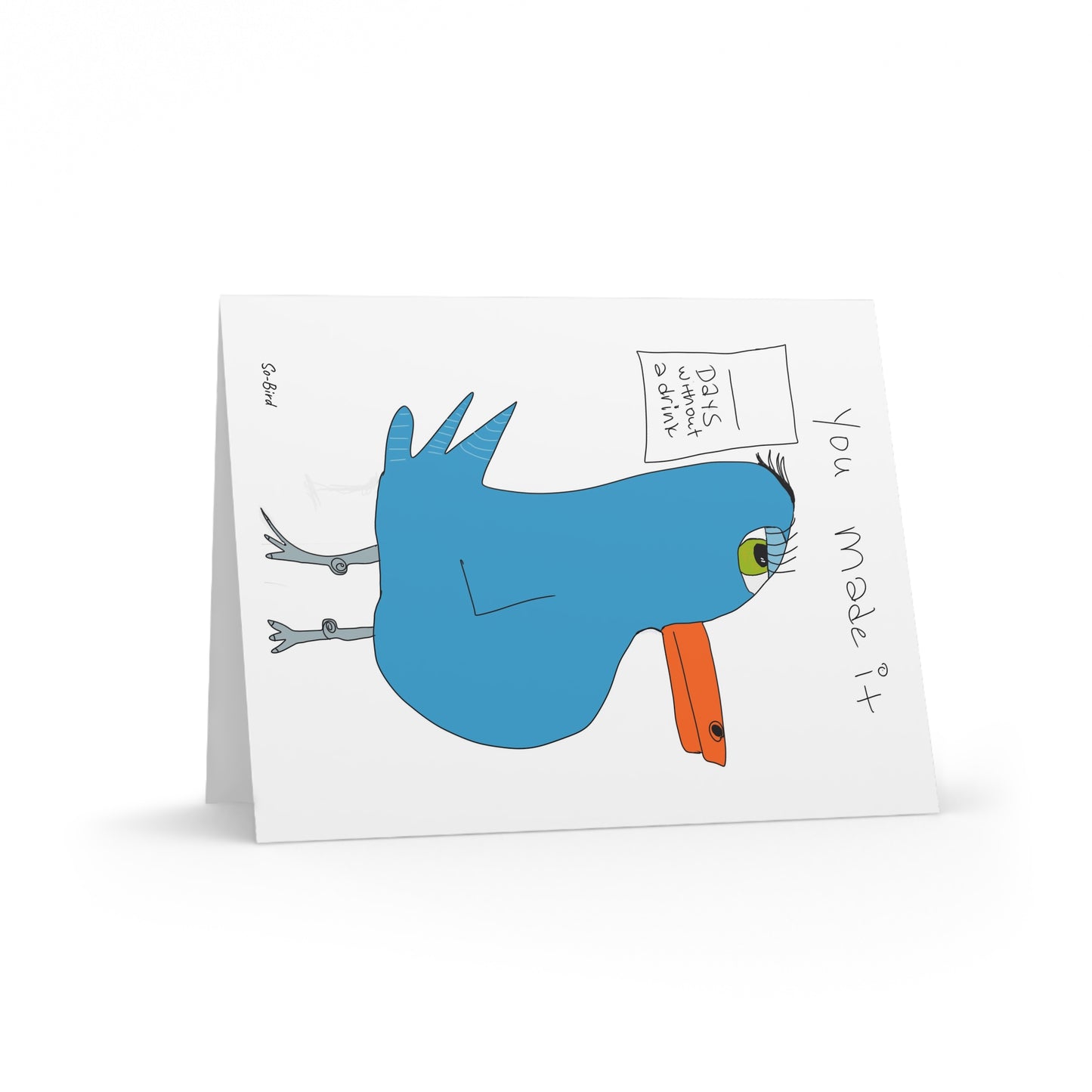 Printify’s Greeting Cards Recovery Celebration features a quirky blue bird with an orange beak and green eye, plus the message "You made it" and a sign saying "You're almost standing still!"—perfect for celebrating recovery milestones.