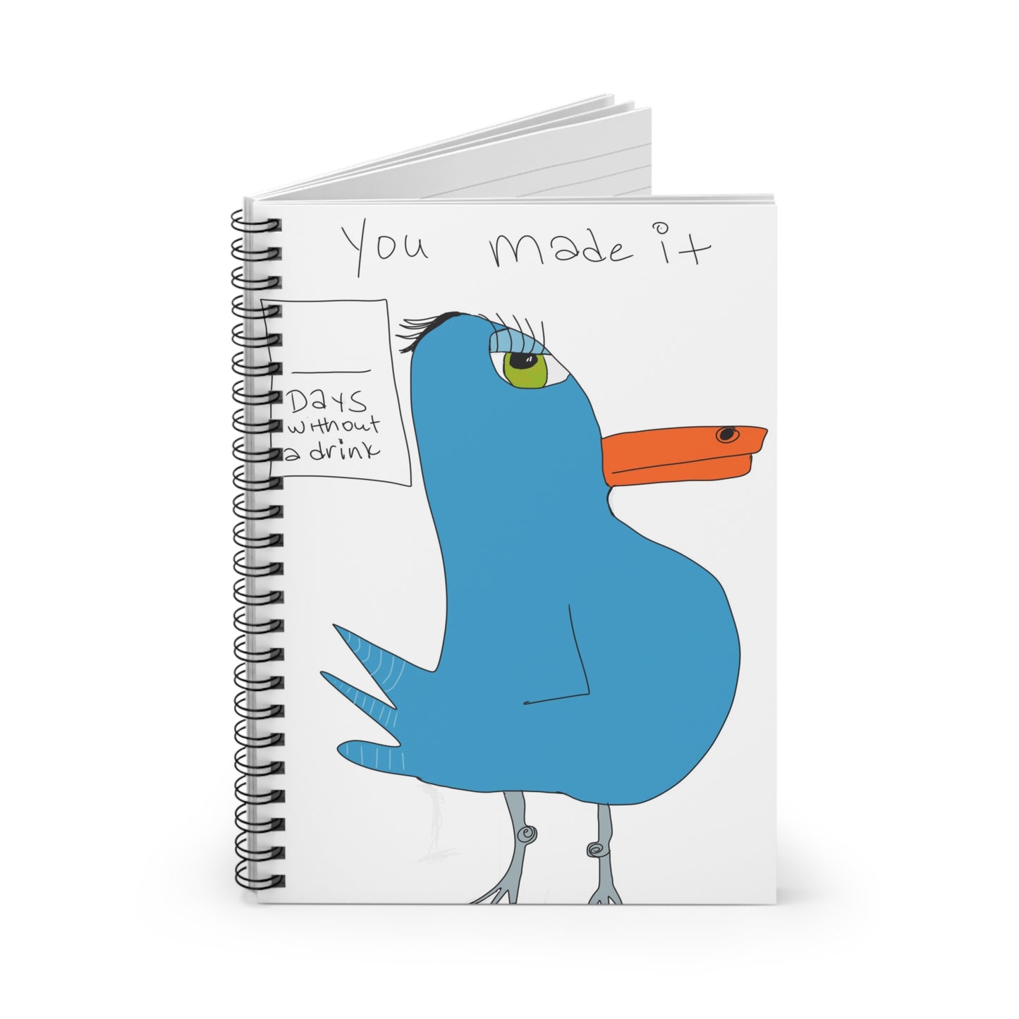 The "Recovery Celebration - Spiraled Notebook- Ruled Line" by Printify (6"x8") features ruled pages, a blue bird with an orange beak, the message “You made it,” and a “DAYS without drink” box for tracking recovery milestones.