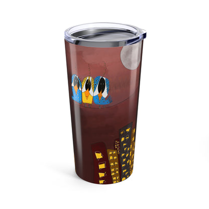 The Printify "Three Birds On A Wire" 20oz tumbler features three colorful birds on a branch under a full moon, perched above city buildings with yellow lights against a dark reddish-brown background.