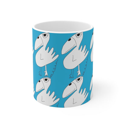 The One Among Many Mug - 11oz by Printify is a white ceramic cup with a blue background, adorned with playful, abstract cartoon birds featuring large beaks, small wings, and curly legs in a whimsical repeating pattern.